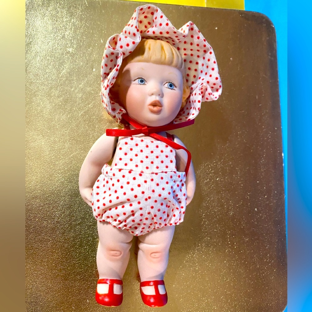 VINTAGE PORCELAIN DOLL WITH MOVEABLE ARMS WEARING WHITE w/RED POLKADOT OUTFIT 6”